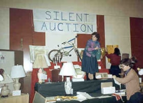 Setting up the silent auction at the Ottawa Hadassah Wizo Bazaar.