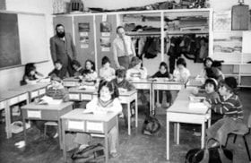 Hillel Academy students working hard at their desks while Principal Rabbi Kaploun and teacher Werner Bauer look on.