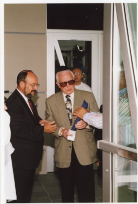 5 photographs showing ceremony to affix the mezuzah at the Soloway Jewish Community Centre.