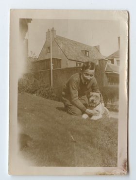 Unknown boy and dog.