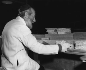 Matzah baking. Copy print of Leib Blitzer photo