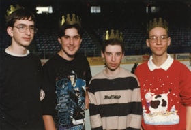 Four unidentified teenagers in crowns