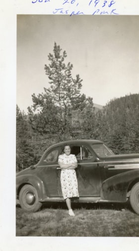 Unidentified woman in front of a car in Jasper Park