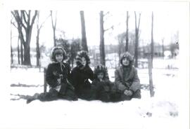 Group portrait of four children, exterior, Adath Israel School, Montreal.