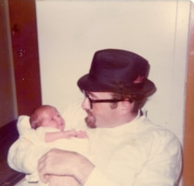 Rabbi Bulka holding a baby