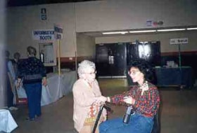 Unidentified individual and Gloria Borts at the Ottawa Hadassah Wizo Bazaar.