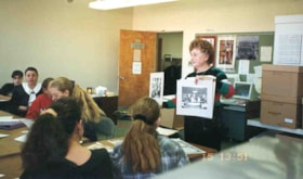 Shirley Berman showing photographs to pupils of a Jewish Afternoon school.