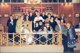 Interior group portrait, Unidentified men and women posing for group portrait in front of the Chevra Shaas Adath Jeshurun Hadrath Kodesh Synagogue Aron Hakodesh.