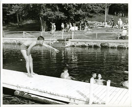 Group portrait of councillor giving swimming instructions to campers, Camp Wooden Acres, Montreal.