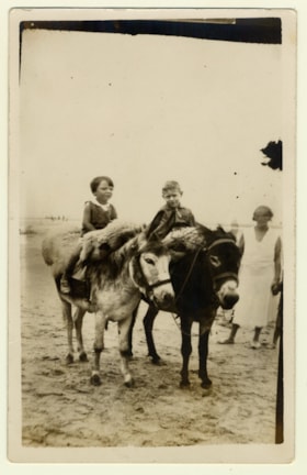 Maurice Shenkier and a friend riding donkeys