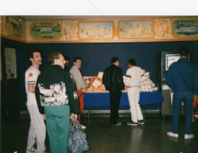 Men looking at a baseball display