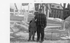 Murray Allice and Gordon Allice in front of ice sculptures