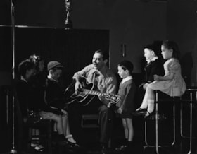 MILLS, Alan - singing with children and other images of singer's work