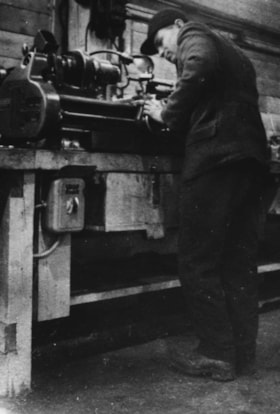 ILE AUX NOIX internment camp, Refugee technician at work