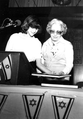 A student with Mrs Aliza Begin at an assembly in her honour during her visit to Hillel Academy.