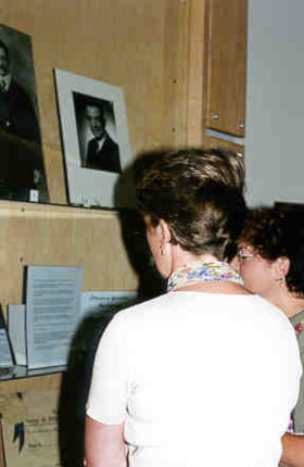 Pamela Miles and Marcia Mordfield looking at the Ottawa Jewish Archives exhibit on David Epstein.