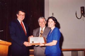 Margo Schwartz receiving the Freiman Young Leadership Award from A. J. Freiman at the Annual General Meeting of the Jewish Community Council of Ottawa.