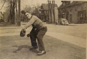 Joseph Osterer playing baseball in the streets of Lowertown.