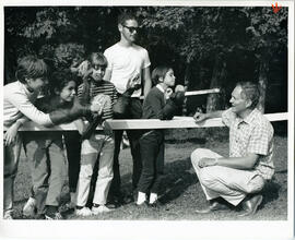 Group portrait of campers demonstrating their puppets, Camp Wooden Acres, Montreal.
